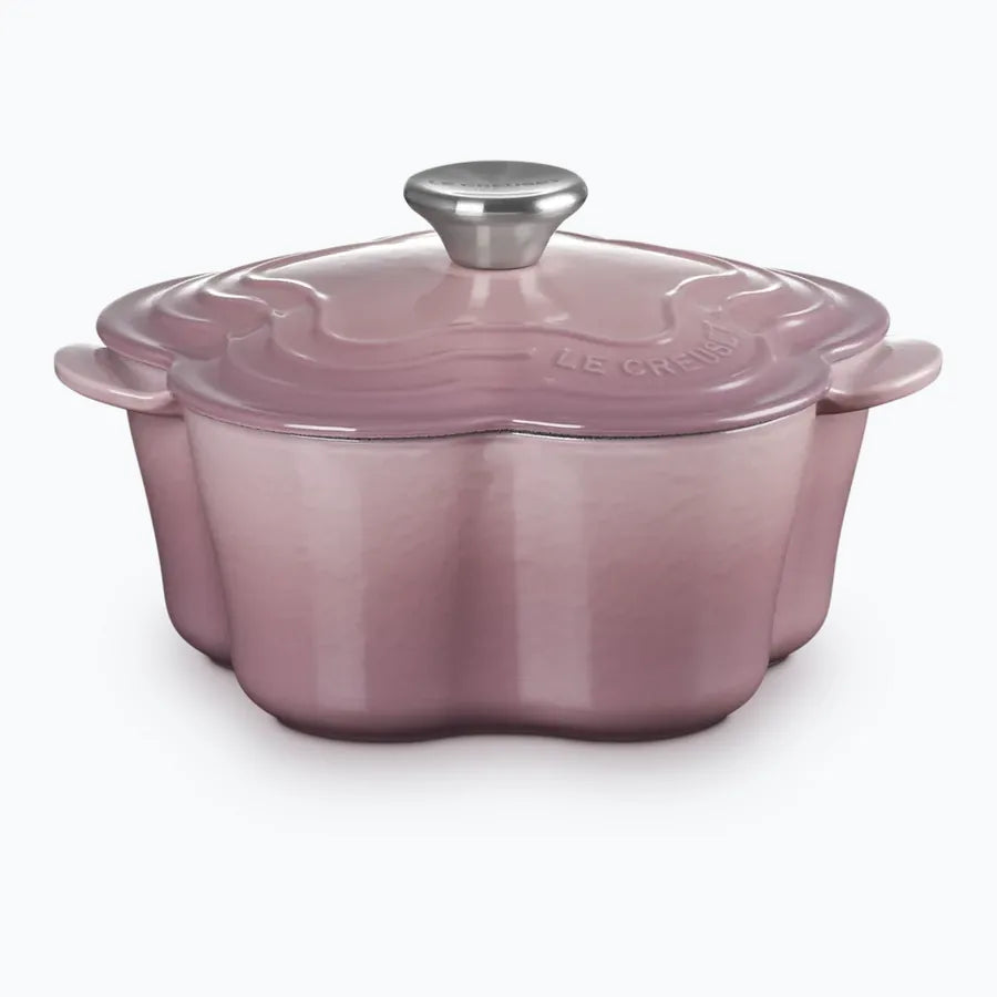 Cast iron flower-shaped casserole in mauve pink with a stainless steel knob