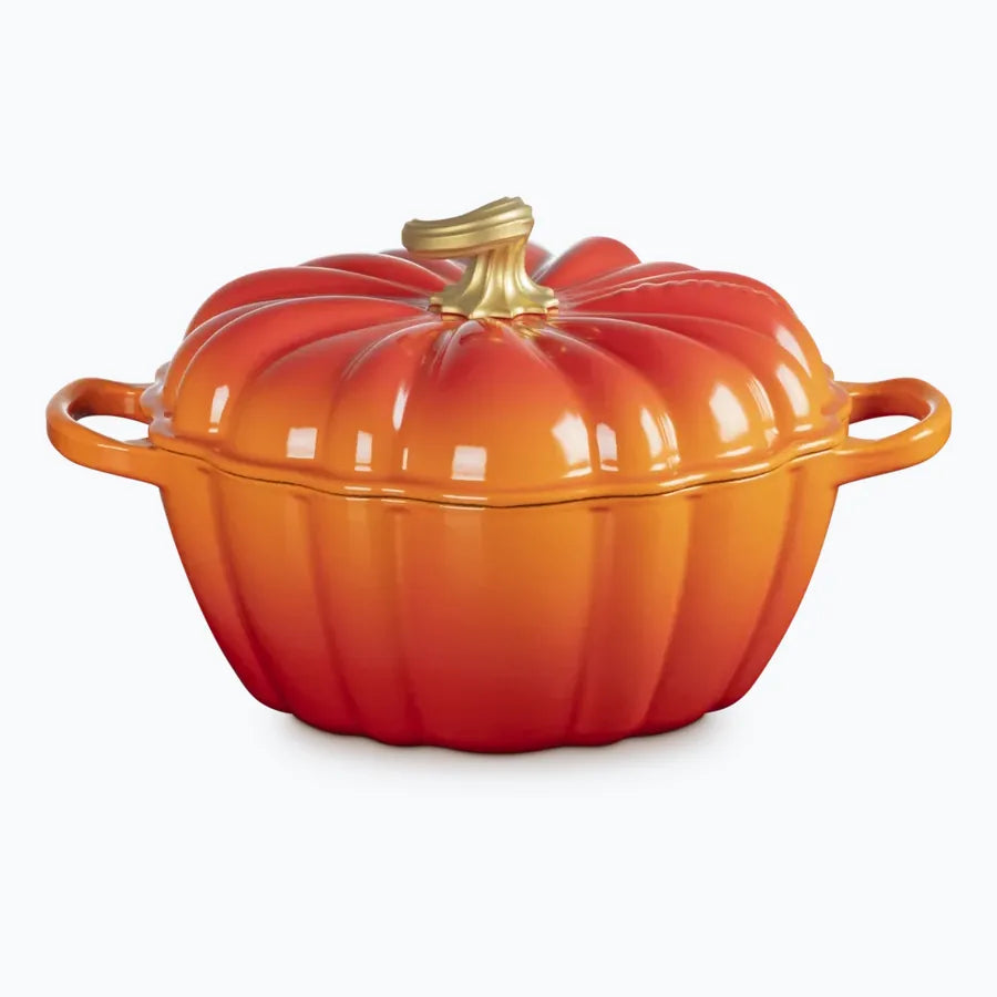 Cast iron pumpkin casserole in volcanic orange, ribbed like a pumpkin with a brass stalk for a knob